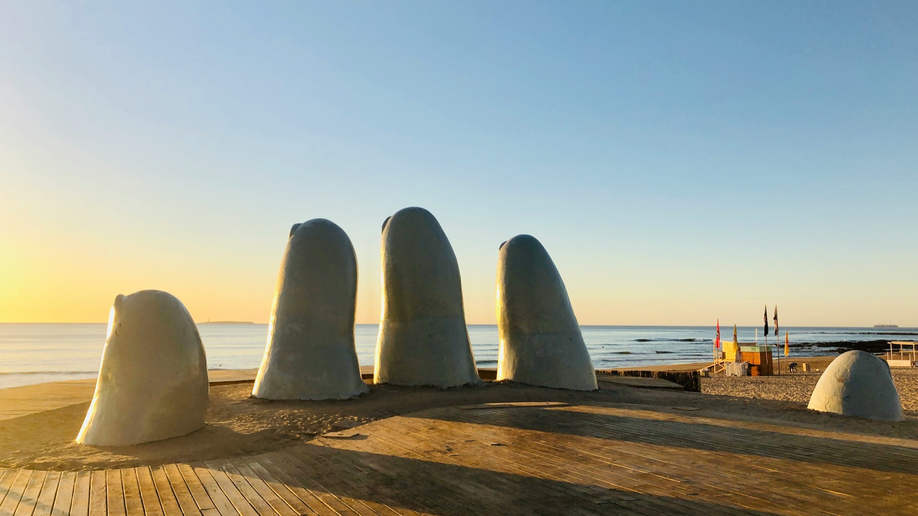 La Mano, the hand sculpture rising from the sand of Playa Brava in Punta del Este at sunrise