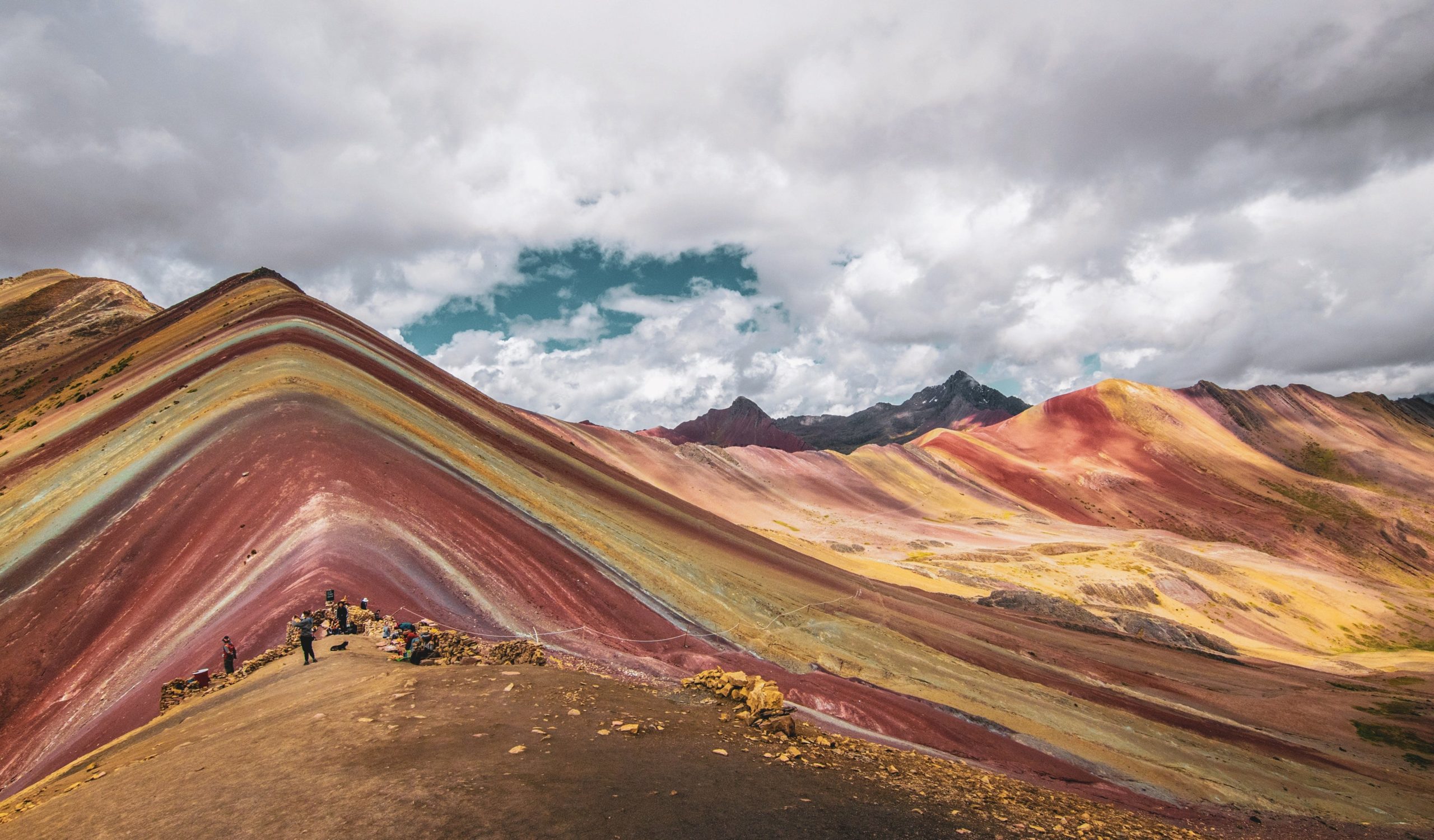 Visit Rainbow Mountain in Peru.